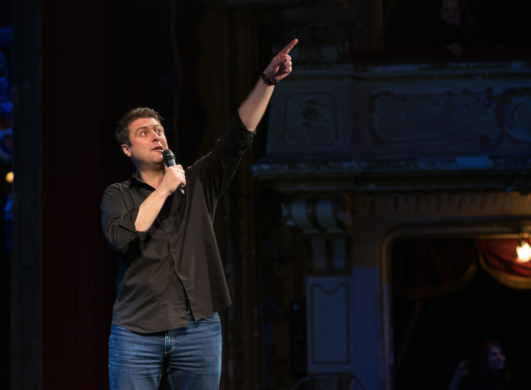 Stand-up comedian's act at National Theater in Cluj-Napoca, Romania